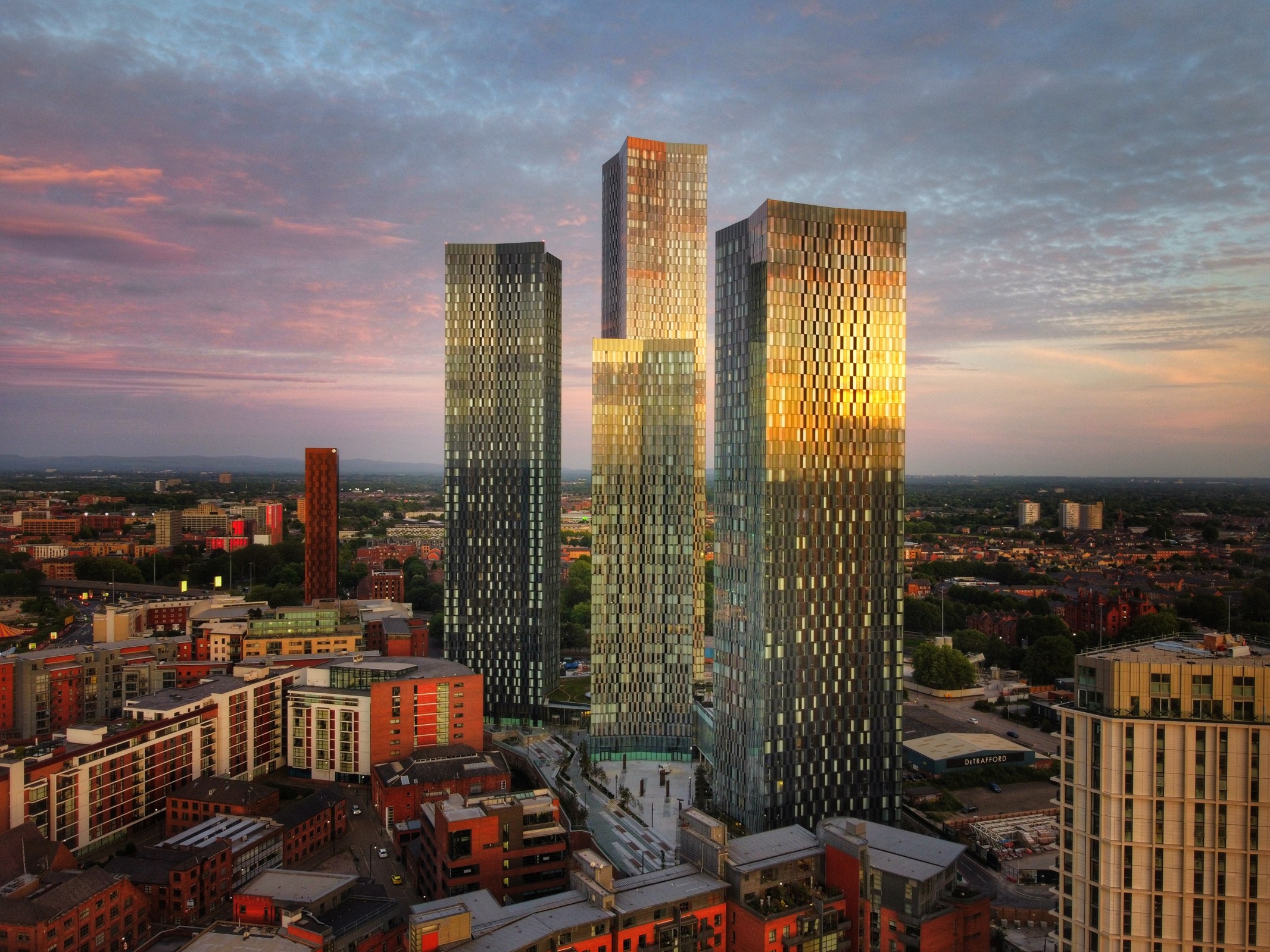 Deansgate Square towers reflecting the sunset over Manchester